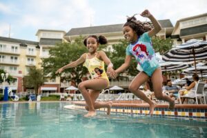 two children jumping into a pool at Walt Disney World Resort