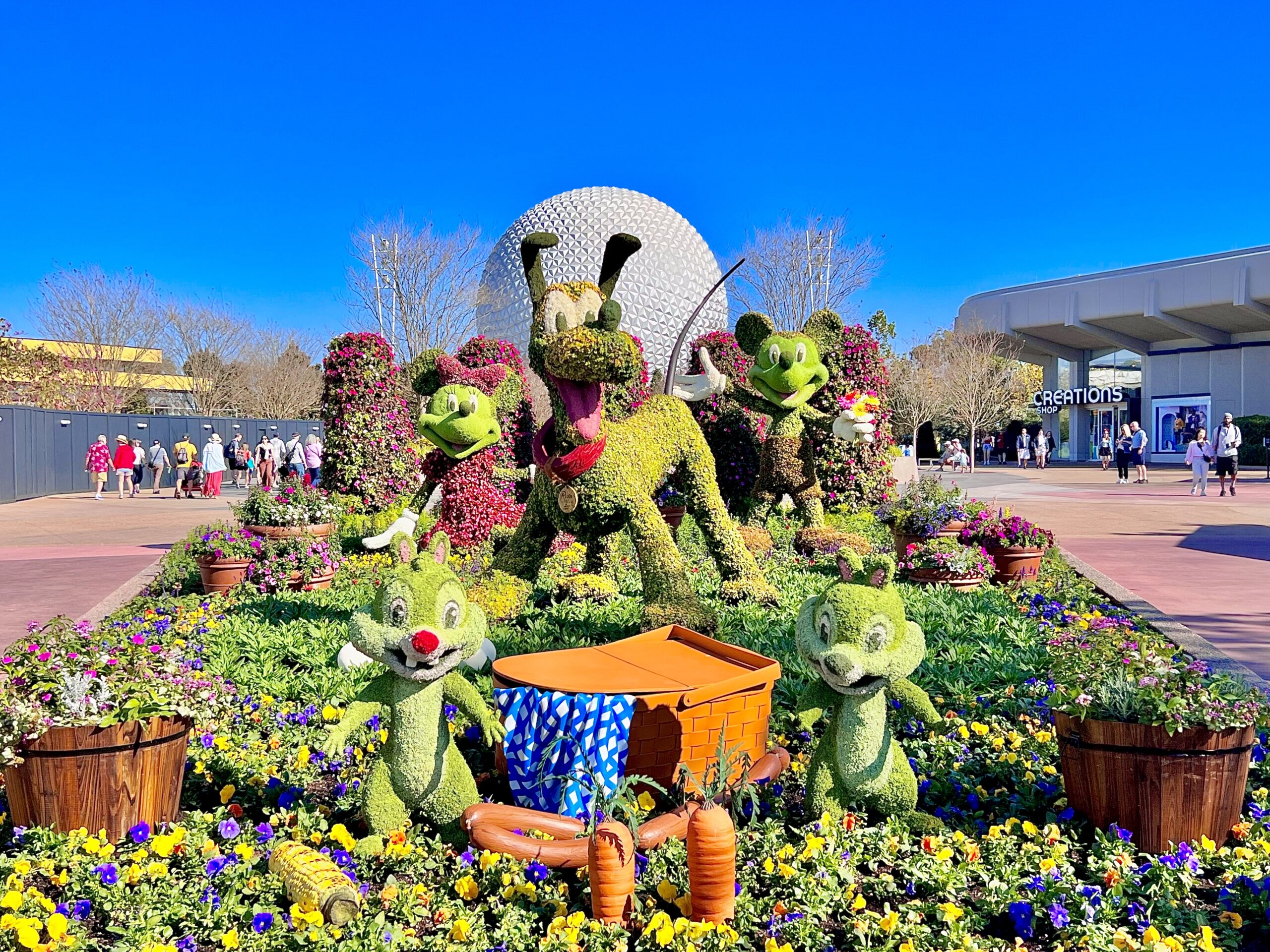 mickey, minnie, pluto, chip, and dale topiaries