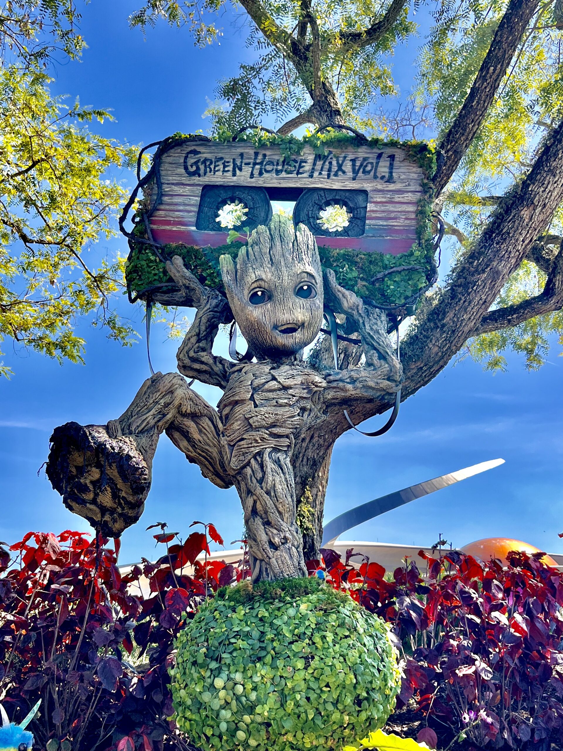 topiary of groot holding a mixtape