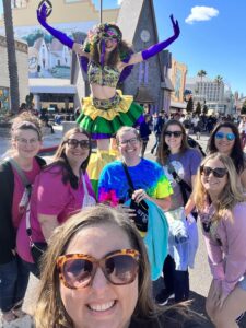 Share the Magic Travel Agents at the Universal Studios Mardi Gras Parade with a Performer on Stilts